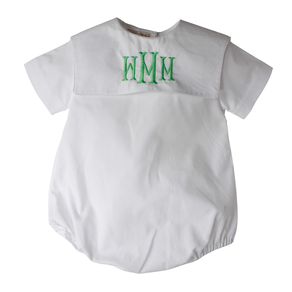 White baby romper with green monogram on a white background
