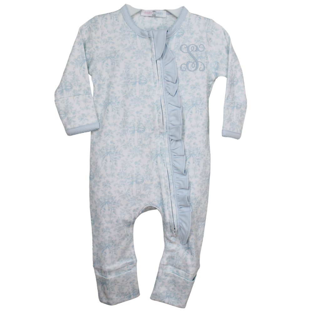 Baby onesie ruffle trim with floral pattern on a white background